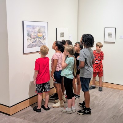group of children looking at artwork in the Mulvane Art Museum