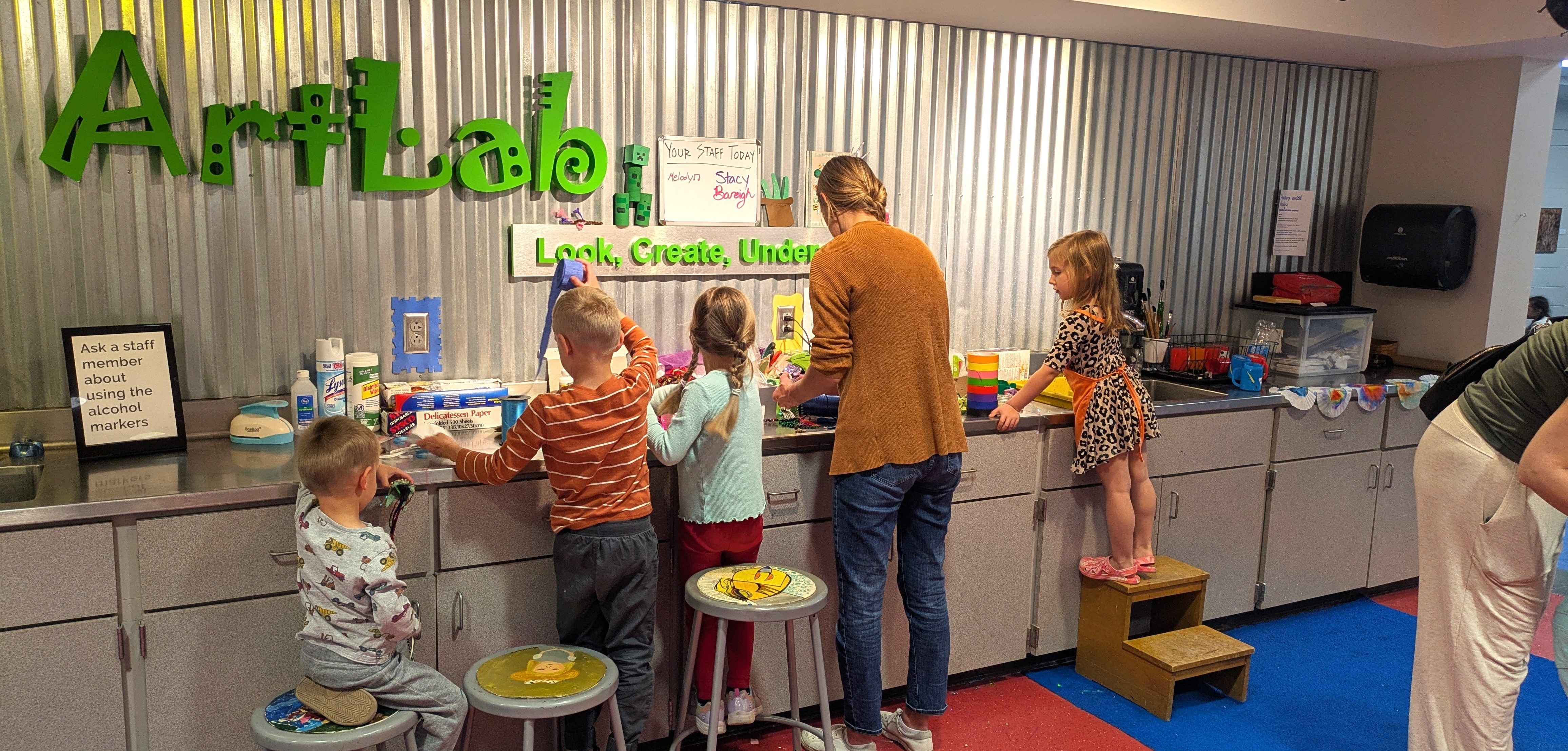 Parent with kids in the Art Lab